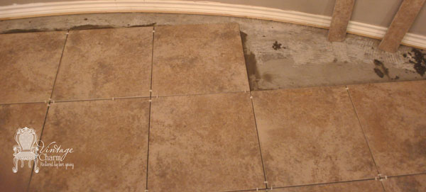 laying-tile-into-cureved-ba